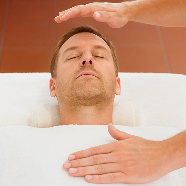 Man under going reiki